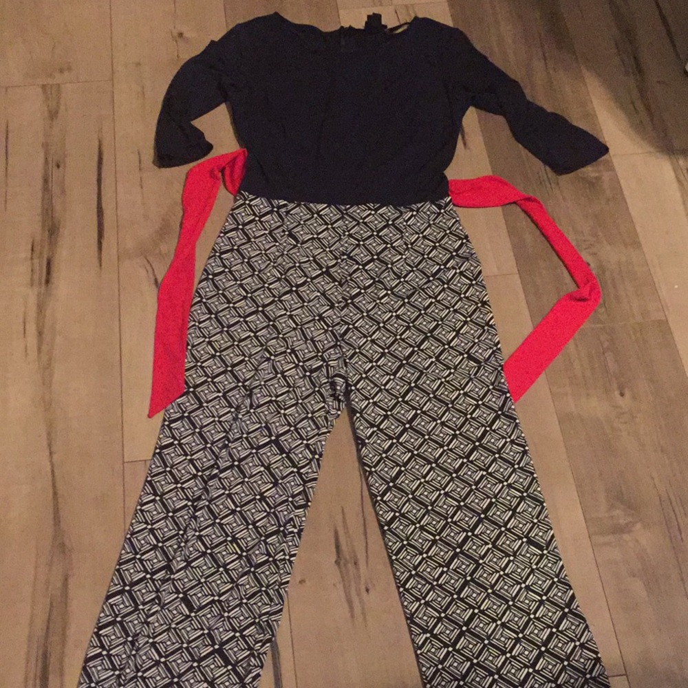 Navy blue jumpsuit with red detail